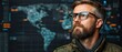 © NDmCX-Nic - A thoughtful man with glasses gazes at a world map, surrounded by digital data and technology, suggesting a focus on global connectivity and information analysis.