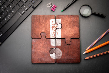 Wall Mural - information acquisition and analysis concept. wooden puzzle pieces with text on a dark office table