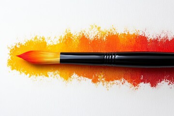 Poster - Vibrant brush strokes creating warm orange hues on textured surface in a creative workspace