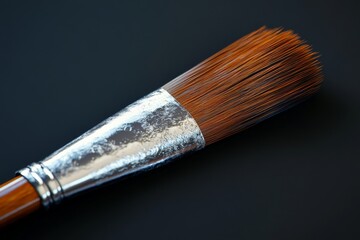 Poster - Artistic brush with fine bristles resting on a dark surface showcasing craftsmanship and detail