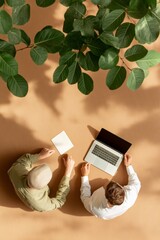 Poster - Eco-Chic Workspace Overview Two Colleagues Enhancing Team Dynamics Amidst Greenery - Modern Business Collaboration and Sustainable Office Aesthetic for Creative Industries
