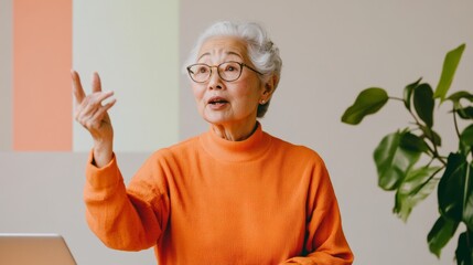 Poster - Minimalist Home Office Elderly Asian Womans Lively Online Presentation in Tech-Forward Workspace with Natural Elements - Empowering Digital Literacy for Seniors