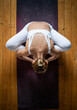 © Melinda Nagy - top view of woman doing yin yoga