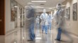 © dony - Blurred Motion of Hospital Staff in Protective Gear