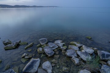 Wall Mural - Serene lakeside view with clear water