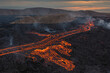 © AmazingAerialAgency - Aerial view of geldingadalir volcano with active lava flow and smoke, Grindavik, Iceland.