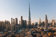 © AmazingAerialAgency - Dubai, United Arab Emirates - 19 February 2022: Aerial view of burj khalifa skyline with modern skyscrapers and beautiful cityscape, Dubai, United Arab Emirates.