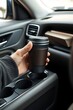 © Michaelyo - Holding Coffee Cup in Car Cup Holder
