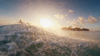 Fototapete - Surfer rides a wave with the scene from above and below the surface. Maldives