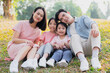 © Timeimage - Young Asian family having a picnic in the park on the weekend