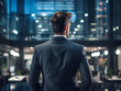 © Phronphan - Businessman Standing in a Modern Office Looking at the City