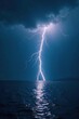 © Nawata - A bolt of lightning illuminates the darkening sea as sunset approaches, sea storm, calm sea, electricity