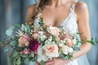 © Gatherina - Bride holding elegant bouquet of pink and white roses and eucalyptus leaves