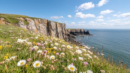 Wall Mural - Coastal wildflowers bloom overlooking dramatic cliffs and ocean