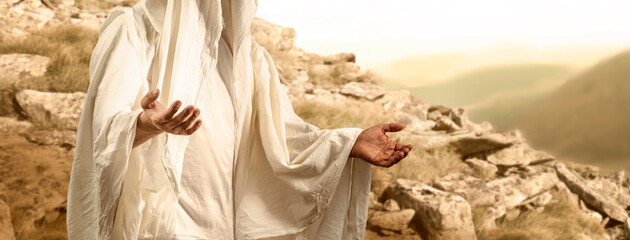 Wall Mural - Man with open arms in a gesture of love and trust preaching and blessing against the background of a mountain. Sermon on the Mount Biblical scene, Holy Scriptures, New Testament, Christian religion