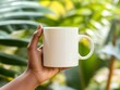 © Rifqi - Mug mockup, Dark skin woman holding a white mug with green background, great concept for branding, advertising, coffee shop, or logo presentation