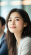 © smth.design - Asian young woman with long hair smiling softly in a bright modern setting, portrait concept
