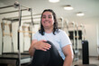 © pabscal - Young woman posing proudly after a Pilates class.