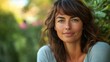© The 2R Artificiality - Smiling Middle-Aged Woman with Brown Hair and Green Eyes Posing Outdoors Surrounded by Lush Greenery in Soft Natural Light