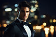 © whitestorm - Male model showcases elegance in sleek tuxedo against a blurred cityscape backdrop at night