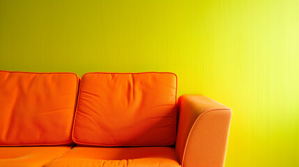 Wall Mural - A bright lime yellow background with a stylish orange single-seater sofa placed to the left, leaving space on the right for text