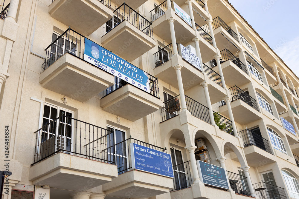Picture of Exterior facade of seaside resort luxury apartment building with signs ...
