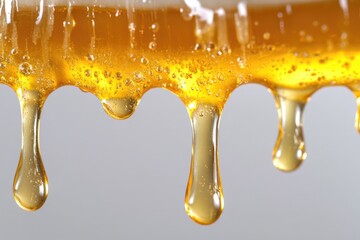 Sticker - A close-up shot of honey dripping from a spoon