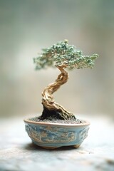 Wall Mural - A small bonsai tree sits in a blue ceramic bowl on a wooden table