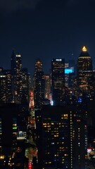 Wall Mural - Raising above the breath-taking panorama of night metropolis. Majestic New York full of lights. Vertical video