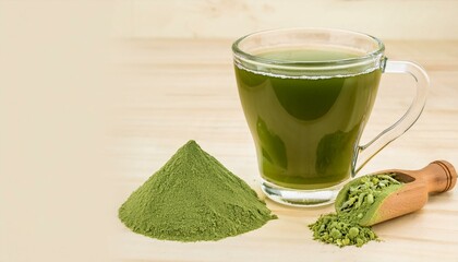 Canvas Print - A cup of vibrant green matcha tea with a pile of powder nearby.