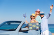 © Sunny studio - Happy family travel by car by the sea