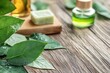 © Ева Поликарпова - A wooden table decorated with fresh green leaves and soap for a unique and natural look