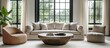 © MUMTAZ - Modern living room with neutral-toned furniture, large windows showcasing a green garden outside