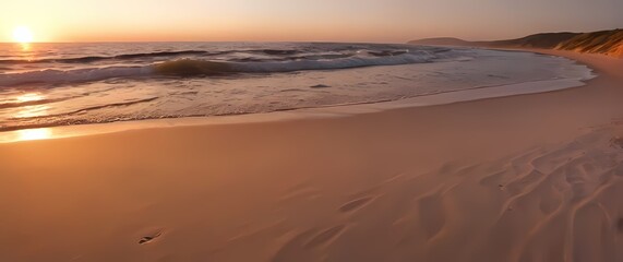 Wall Mural - Picturesque scene of a quiet beach with soft sand and gentle waves at sunset