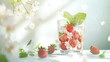 © Igor - A glass of water with strawberries, beside a white-flowered tree branch with green leaves