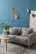 © Pixel-Shot - Interior of living room with wind chime, dream catcher and sofa