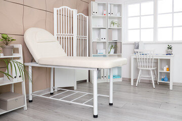 Sticker - Interior of medical office with couch, doctor's workplace and folding screen