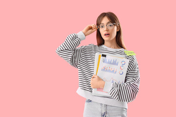 Canvas Print - Shocked teenage girl with laptop and diagrams on pink background. Online work concept