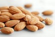 © Andrii Savchuk - Close up of fresh almonds scattered on a clean wooden surface