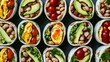 © Studium L&M - Hawaiian street food burritos with fresh avocado, cherry tomatoes, beans, and eggs arranged in vibrant pattern display