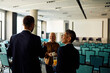 © Boris Jovanovic/Stocksy - Colleagues chat at the conference room