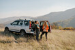 © Mihajlo Ckovric/Stocksy - Family Enjoying Scenic Hillside View During a Road Trip Adventure