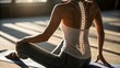 © Phurichai - Woman practicing yoga spine health and flexibility back workout healthy lifestyle