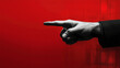 © behindlens - hand pointing with one finger against vibrant red background, conveying sense of direction and emphasis. image evokes strong emotions and captures attention