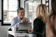 © Sean Locke/Stocksy - Business: Man And Woman Meeting For Business In Cafe