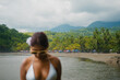 © Carlos Gonzales/Stocksy - Woman at a tropical beach during summer vacation