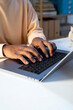 © Jimena Roquero/Stocksy - Crop of anonymous man's hands typing on laptop keyboard