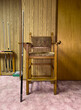 © Raymond Forbes LLC/Stocksy - Vintage Billiard Chair from seventies with wood paneling shag rug