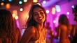 © HISTOCK - Young woman smiling and having fun at a nightclub party