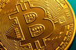 © Tatyana Lavrova/Stocksy - Golden bitcoin coin close up. Digital currency background